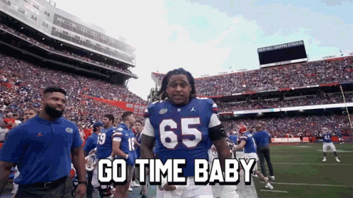 Football Player in Blue Jersey Number 65