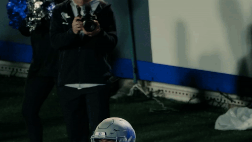 Football Player in Blue Memphis Jersey