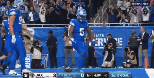 Football Player in Blue Uniform Number 5