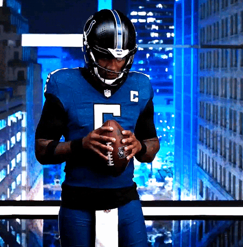 Football Player In Blue Uniform With Letter C GIF
