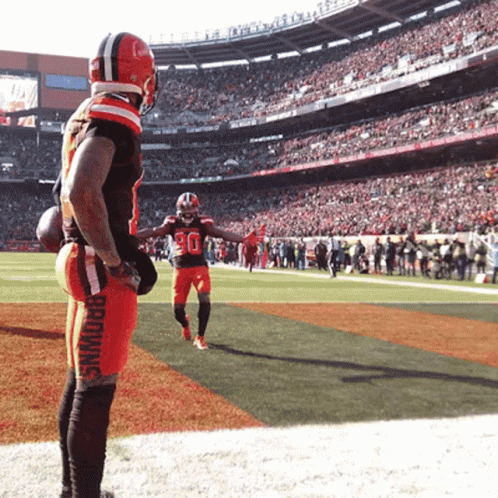 Football Player in Browns Jersey