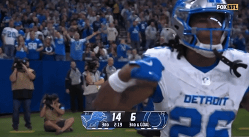 Football Player in Detroit Jersey Celebrates