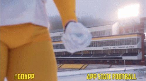 Football Player in Front of App State Football Stadium