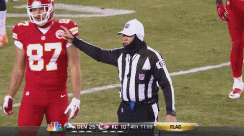 Football Player in Front of Chiefs Kingdom Sign