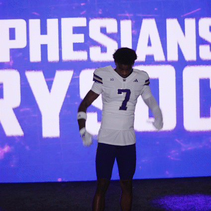 Football Player in Front of Pheisians Screen