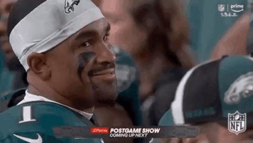 Football Player in Green Jersey and Headband Smiling