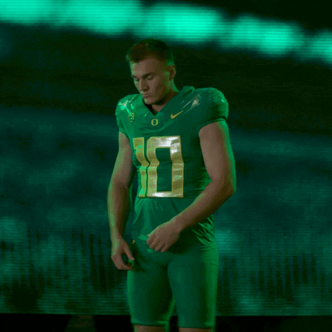 Football Player In Green Jersey Number 10 Arms Crossed GIF