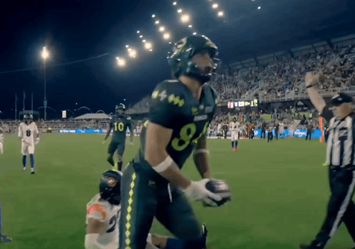 Football Player In Green Uniform Number 8 GIF