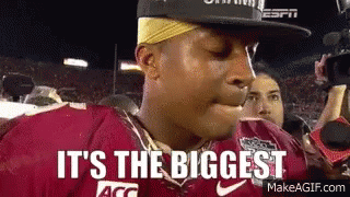 Football Player in Hat and Red Jersey Saying It's the Biggest
