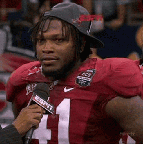 Football Player in Hat Interviewed by ESPN Reporter