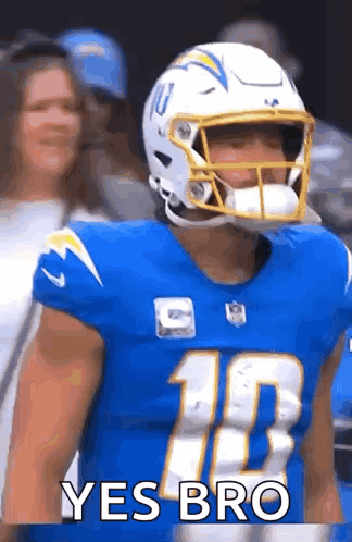 Football Player In Helmet And Blue Jersey In Front Of Crowd GIF