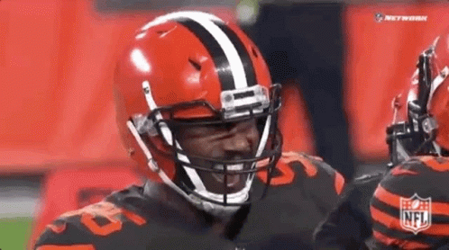 Football Player in Helmet and Jersey