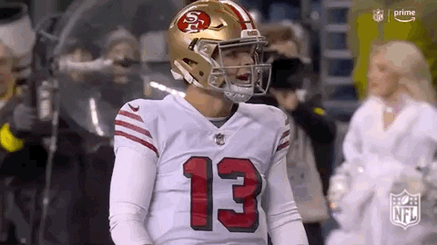 Football Player in Helmet and Number 13 Jersey