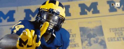 Football Player in Helmet and Number 14 Jersey