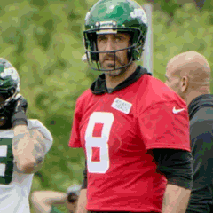 Football Player in Helmet and Red Jersey Number 8