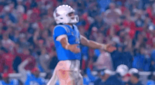 Football Player in Helmet on Field