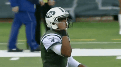 Football Player in Helmet Saying NYC