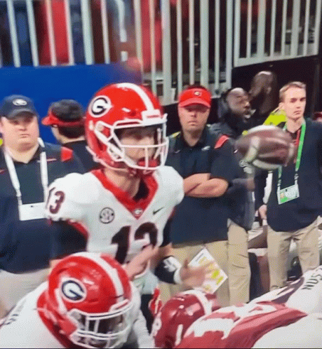 Football Player in Helmet With G