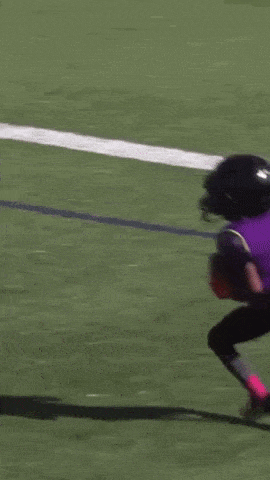 Football Player in Helmet With Letter T