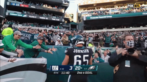 Football Player In Jersey Number 65 GIF