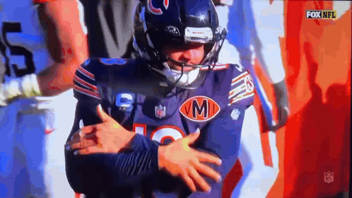 Football Player in Jersey With Letter M