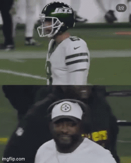 Football Player in Jets Helmet Next to Man in Steelers Hat