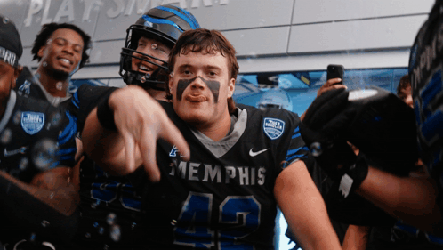 Football Player in Memphis Jersey Pointing
