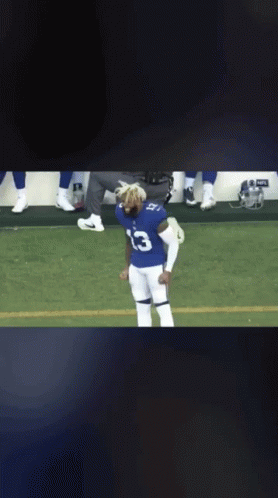 Football Player in Number 13 Jersey on Field
