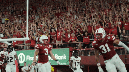 Football Player in Number 3 Jersey in Front of Crowd