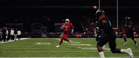 Football Player in Number 6 Jersey Running