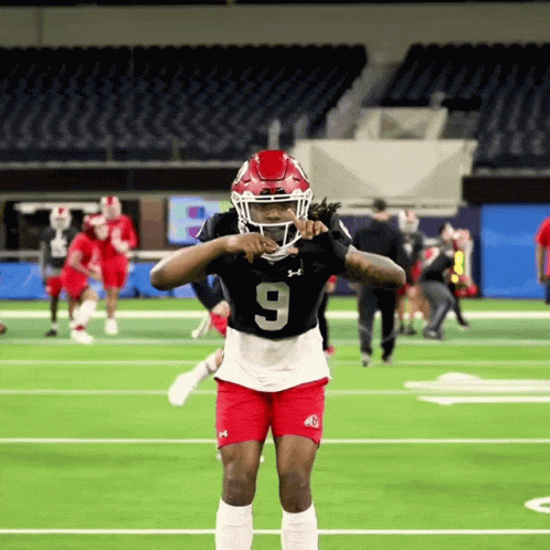 Football Player in Number 9 Jersey on Field