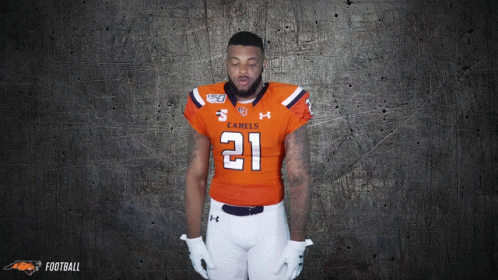 Football Player in Orange Jersey Number 21