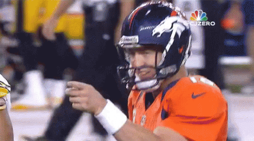 Football Player In Orange Jersey With Horse Helmet GIF