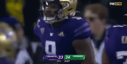 Football Player In Purple Jersey Helmet GIF
