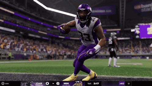 Football Player in Purple Jersey Number 23