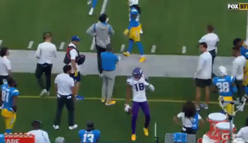 Football Player In Purple Uniform Dancing On Field GIF