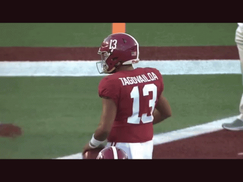 Football Player in Red Jersey Number 13