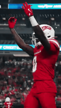 Football Player in Red Jersey Number 13