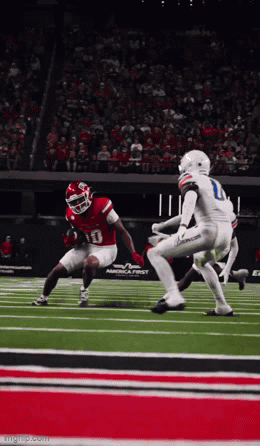 Football Player in Red Jersey Number 13