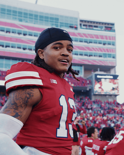 Football Player in Red Jersey Number 13