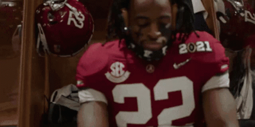 Football Player In Red Jersey Number 22 Sitting With Eyes Closed GIF