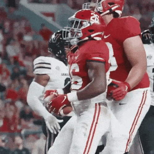 Football Player in Red Jersey Number 26