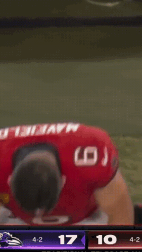 Football Player in Red Jersey Number 6