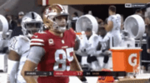 Football Player In Red Jersey Number 85 By Gatorade Bucket GIF