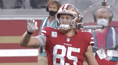 Football Player in Red Jersey Number 85 Waving