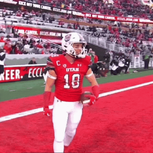 Football Player in Red Jersey Running