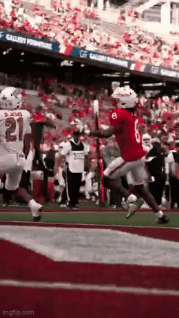 Football Player in Red Jersey Running