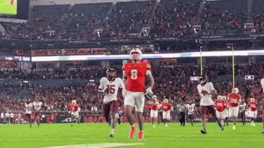 Football Player in Red Jersey Running