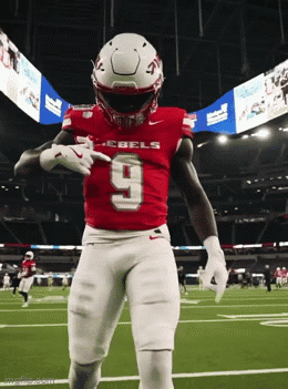 Football Player in Red Rebels Jersey Dancing