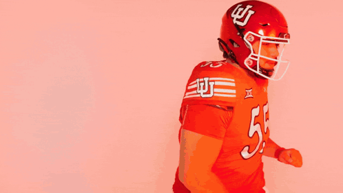 Football Player in Red Uniform Number 55